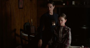 Movie still from “The Piano” (1993), directed by Jane Campion – A woman standing next to a young girl in a room; Medium shot, Over the shoulder angle