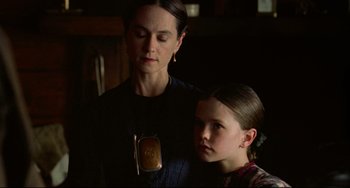 Movie still from “The Piano” (1993), directed by Jane Campion – A woman standing next to a young girl in a room; Close Up shot, Over the shoulder angle