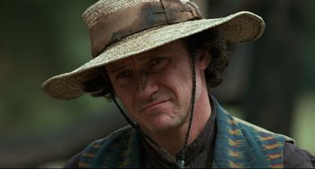 Movie still from “The Piano” (1993), directed by Jane Campion – A person wearing a hat; Close Up shot, Over the shoulder angle