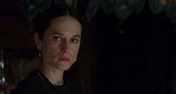 Movie still from “The Piano” (1993), directed by Jane Campion – A person wearing a black shirt; Close Up shot, Over the shoulder angle