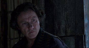 Movie still from “The Piano” (1993), directed by Jane Campion – A person wearing a black shirt; Close Up shot, Over the shoulder angle