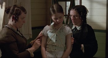 Movie still from “The Piano” (1993), directed by Jane Campion – A woman and a girl are looking at each other; Medium shot, Over the shoulder angle