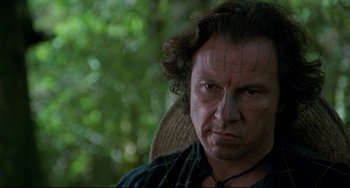 Movie still from “The Piano” (1993), directed by Jane Campion – A person with a face tattoo; Close Up shot, Low angle