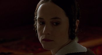 Movie still from “The Piano” (1993), directed by Jane Campion – A person wearing a dress; Close Up shot, Over the shoulder angle