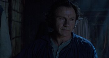 Movie still from “The Piano” (1993), directed by Jane Campion – A person wearing a blue shirt; Close Up shot, Low angle