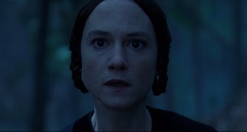 Movie still from “The Piano” (1993), directed by Jane Campion – A person wearing a black shirt; Close Up shot, Over the shoulder angle