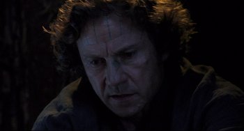 Movie still from “The Piano” (1993), directed by Jane Campion – A person wearing a black shirt; Close Up shot, Low angle