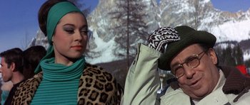 Movie still from “The Pink Panther” (1963), directed by Blake Edwards – A woman and a man wearing winter clothing; Close Up shot, Low angle