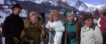 Movie still from “The Pink Panther” (1963), directed by Blake Edwards – A group of women standing next to each other in the snow; Medium shot, Low angle