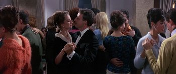 Movie still from “The Pink Panther” (1963), directed by Blake Edwards – A man and a woman dancing in front of a crowd; Medium shot, Low angle