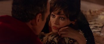 Movie still from “The Pink Panther” (1963), directed by Blake Edwards – A man and a woman looking at one another in a mirror; Close Up shot, High angle