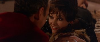 Movie still from “The Pink Panther” (1963), directed by Blake Edwards – A man and a woman smiling at each other; Close Up shot, Over the shoulder angle