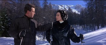 Movie still from “The Pink Panther” (1963), directed by Blake Edwards – A man and a woman in the middle of a snow covered field; Medium shot, Over the shoulder angle