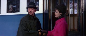Movie still from “The Pink Panther” (1963), directed by Blake Edwards – A man and a woman shaking hands on a train; Medium shot, Over the shoulder angle