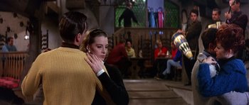 Movie still from “The Pink Panther” (1963), directed by Blake Edwards – A man and a woman are dancing in a room; Medium shot, Over the shoulder angle