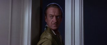 Movie still from “The Pink Panther” (1963), directed by Blake Edwards – A person standing in a room; Close Up shot, Over the shoulder angle