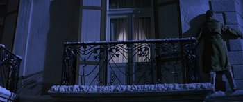 Movie still from “The Pink Panther” (1963), directed by Blake Edwards – A balcony with a wrought iron railing at night; Wide shot, Low angle
