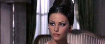 Movie still from “The Pink Panther” (1963), directed by Blake Edwards – A person wearing a dress; Close Up shot, Over the shoulder angle