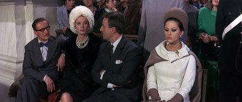 Movie still from “The Pink Panther” (1963), directed by Blake Edwards – A man and two women sitting next to each other; Medium shot, Over the shoulder angle