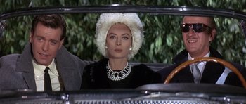 Movie still from “The Pink Panther” (1963), directed by Blake Edwards – A woman in a fur hat sitting in the back of a car; Close Up shot, Low angle