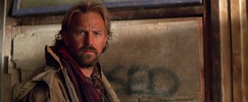 Movie still from “The Postman” (1997), directed by Kevin Costner – A person with a beard; Close Up shot, Low angle