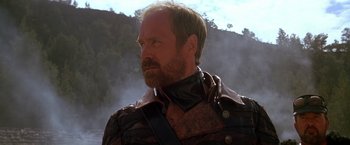 Movie still from “The Postman” (1997), directed by Kevin Costner – A person wearing a leather jacket; Close Up shot, Low angle