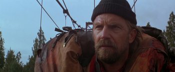 Movie still from “The Postman” (1997), directed by Kevin Costner – A person wearing a hat; Close Up shot, Low angle