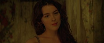 Movie still from “The Postman” (1997), directed by Kevin Costner – A person with long brown hair; Close Up shot, Over the shoulder angle