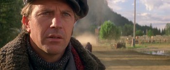 Movie still from “The Postman” (1997), directed by Kevin Costner – A person wearing a hat; Close Up shot, Low angle