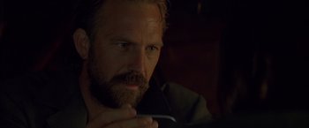 Movie still from “The Postman” (1997), directed by Kevin Costner – A person with a beard; Close Up shot, Over the shoulder angle