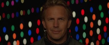 Movie still from “The Postman” (1997), directed by Kevin Costner – A person wearing a jacket; Close Up shot, Low angle