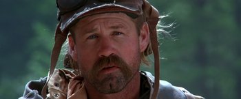 Movie still from “The Postman” (1997), directed by Kevin Costner – A person wearing a hat; Close Up shot, Low angle