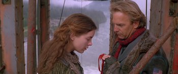 Movie still from “The Postman” (1997), directed by Kevin Costner – A man and a woman standing next to each other; Close Up shot, Over the shoulder angle