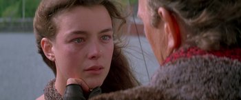 Movie still from “The Postman” (1997), directed by Kevin Costner – A young woman looking at an older man; Close Up shot, Over the shoulder angle