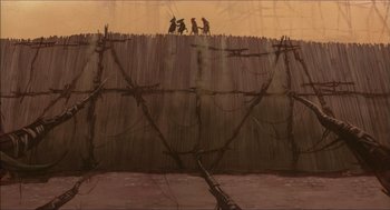 Movie still from “The Prince of Egypt” (1998), directed by Brenda Chapman – A group of people standing on top of barbed wire fence; Extreme Wide shot, Low angle
