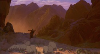 Movie still from “The Prince of Egypt” (1998), directed by Brenda Chapman – A man standing on top of a hill next to a herd of sheep; Extreme Wide shot, Low angle
