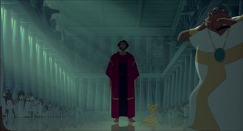 Movie still from “The Prince of Egypt” (1998), directed by Brenda Chapman – A man in a robe stands in front of a statue; Wide shot, Low angle