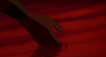 Movie still from “The Prince of Egypt” (1998), directed by Brenda Chapman – A hand with a knife in a red background; Extreme Close Up shot, Overhead angle