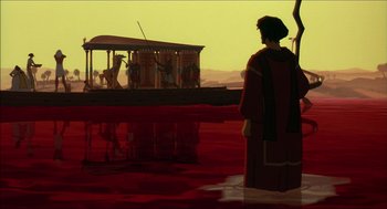 Movie still from “The Prince of Egypt” (1998), directed by Brenda Chapman – A man standing next to a body of water; Wide shot, Over the shoulder angle