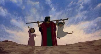 Movie still from “The Prince of Egypt” (1998), directed by Brenda Chapman – A group of people standing next to each other in the desert; Wide shot, Low angle