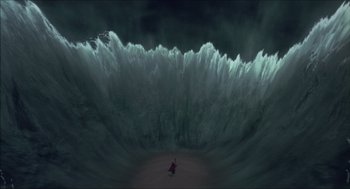 Movie still from “The Prince of Egypt” (1998), directed by Brenda Chapman – A person standing in front of a large wave; Extreme Wide shot, High angle