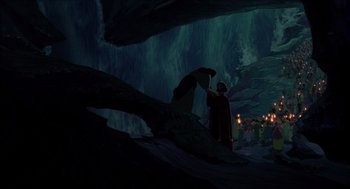 Movie still from “The Prince of Egypt” (1998), directed by Brenda Chapman – A man in a cave with a bunch of people around him; Extreme Wide shot, High angle