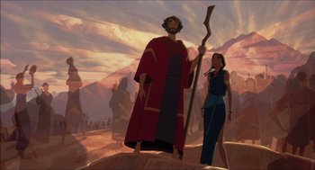 Movie still from “The Prince of Egypt” (1998), directed by Brenda Chapman – A man and a woman standing on top of a hill; Wide shot, Low angle