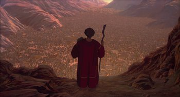 Movie still from “The Prince of Egypt” (1998), directed by Brenda Chapman – A man standing on top of a mountain looking at a city; Extreme Wide shot, High angle