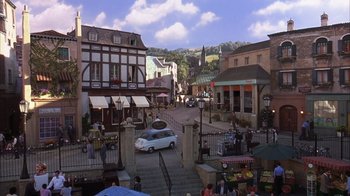 Movie still from “The Princess Diaries 2: Royal Engagement” (2004), directed by Garry Marshall – An image of an outdoor market in a town square; Extreme Wide shot, High angle