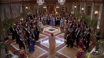 Movie still from “The Princess Diaries 2: Royal Engagement” (2004), directed by Garry Marshall – A group of people in formal wear standing in a room; Extreme Wide shot, High angle