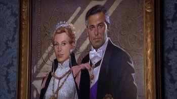 Movie still from “The Princess Diaries 2: Royal Engagement” (2004), directed by Garry Marshall – A man and a woman dressed in formal wear; Close Up shot, Low angle
