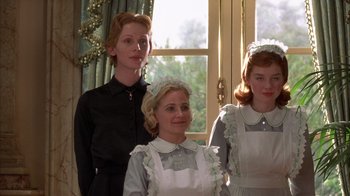 Movie still from “The Princess Diaries 2: Royal Engagement” (2004), directed by Garry Marshall – A group of women standing next to each other in front of a window; Medium shot, Low angle