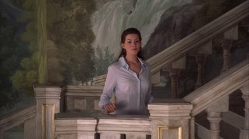 Movie still from “The Princess Diaries 2: Royal Engagement” (2004), directed by Garry Marshall – A woman standing on top of a stone pillar; Medium shot, Low angle