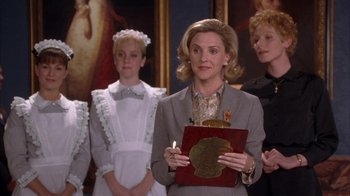 Movie still from “The Princess Diaries 2: Royal Engagement” (2004), directed by Garry Marshall – A group of women standing next to each other in front of a painting; Medium shot, Over the shoulder angle